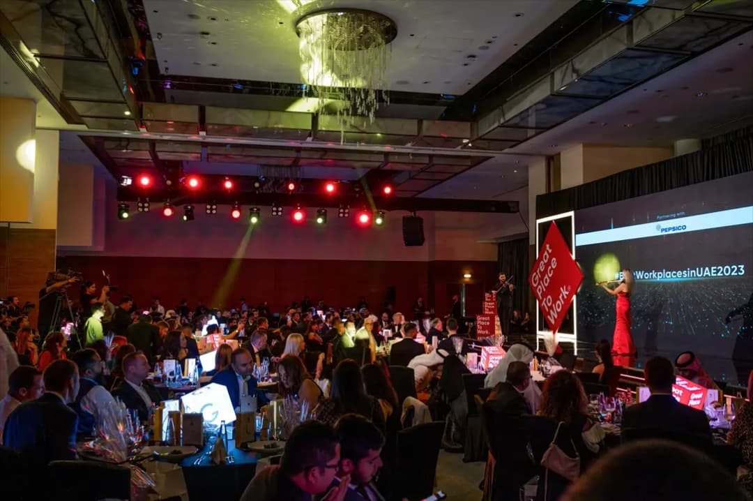 Cogent Solutions team receiving Best Workplace recognition