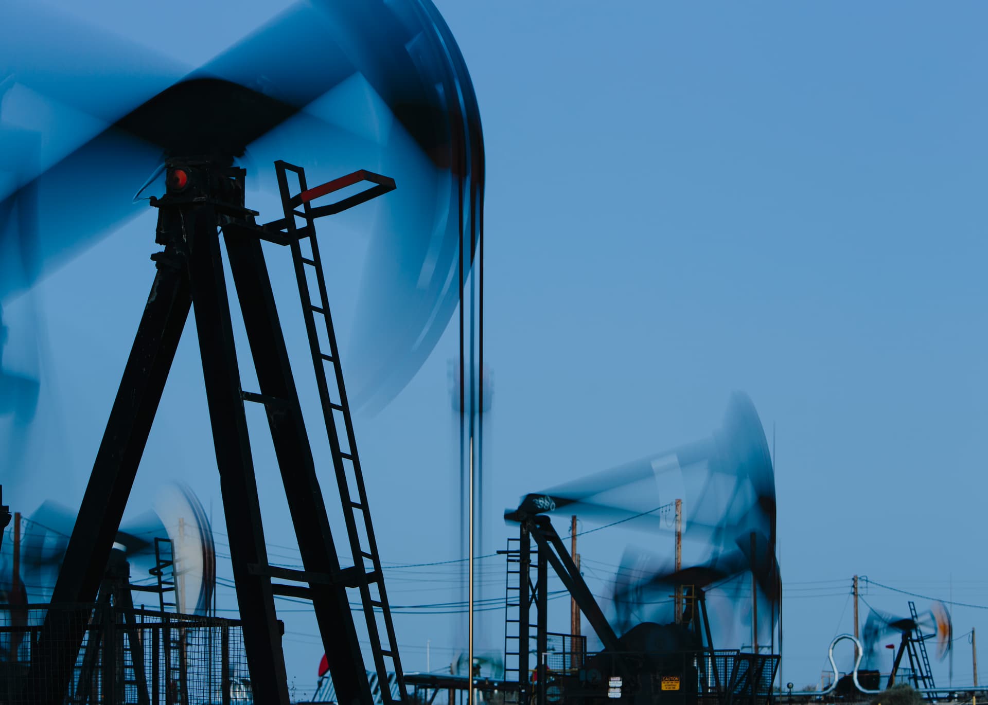 Oil pumpjacks operating across an energy field
