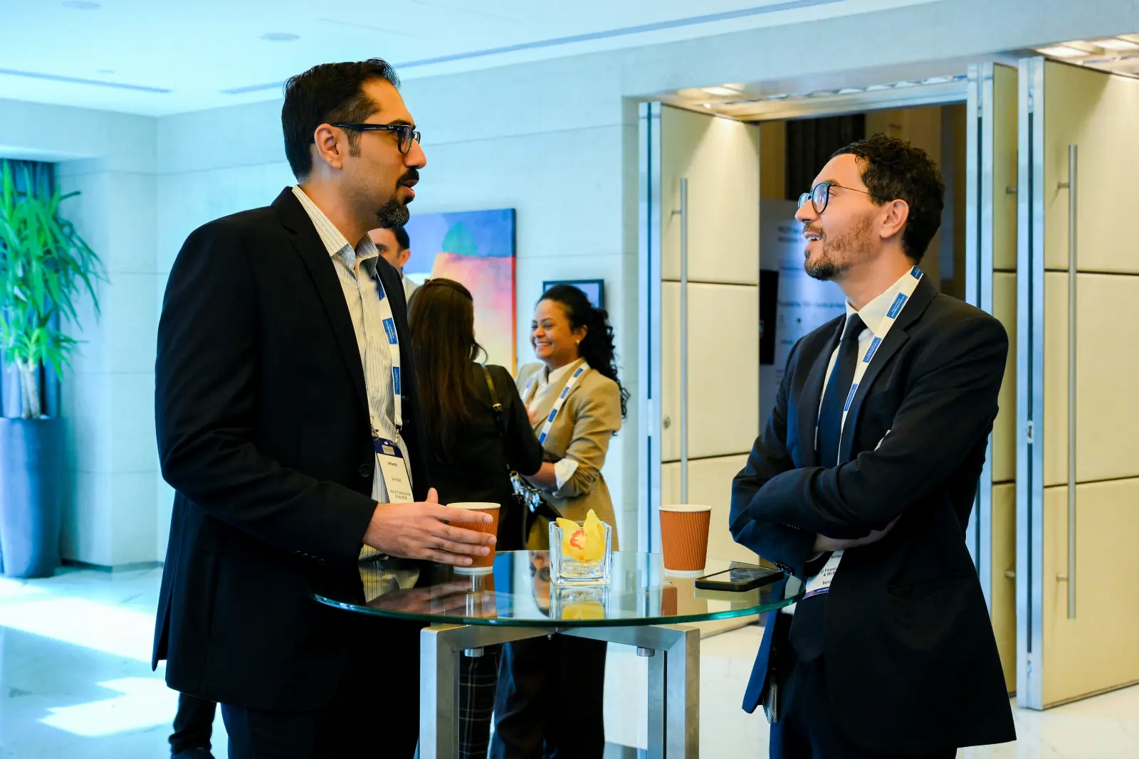A conversation on the exhibition floor at a Cogent event